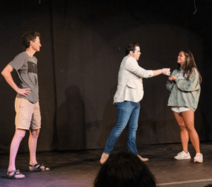 Bentley Burns involving student volunteers during an interactive magic show.